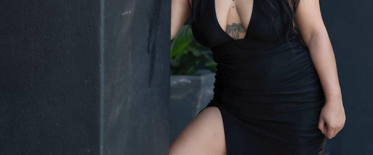 massage therapist amira in a black dress