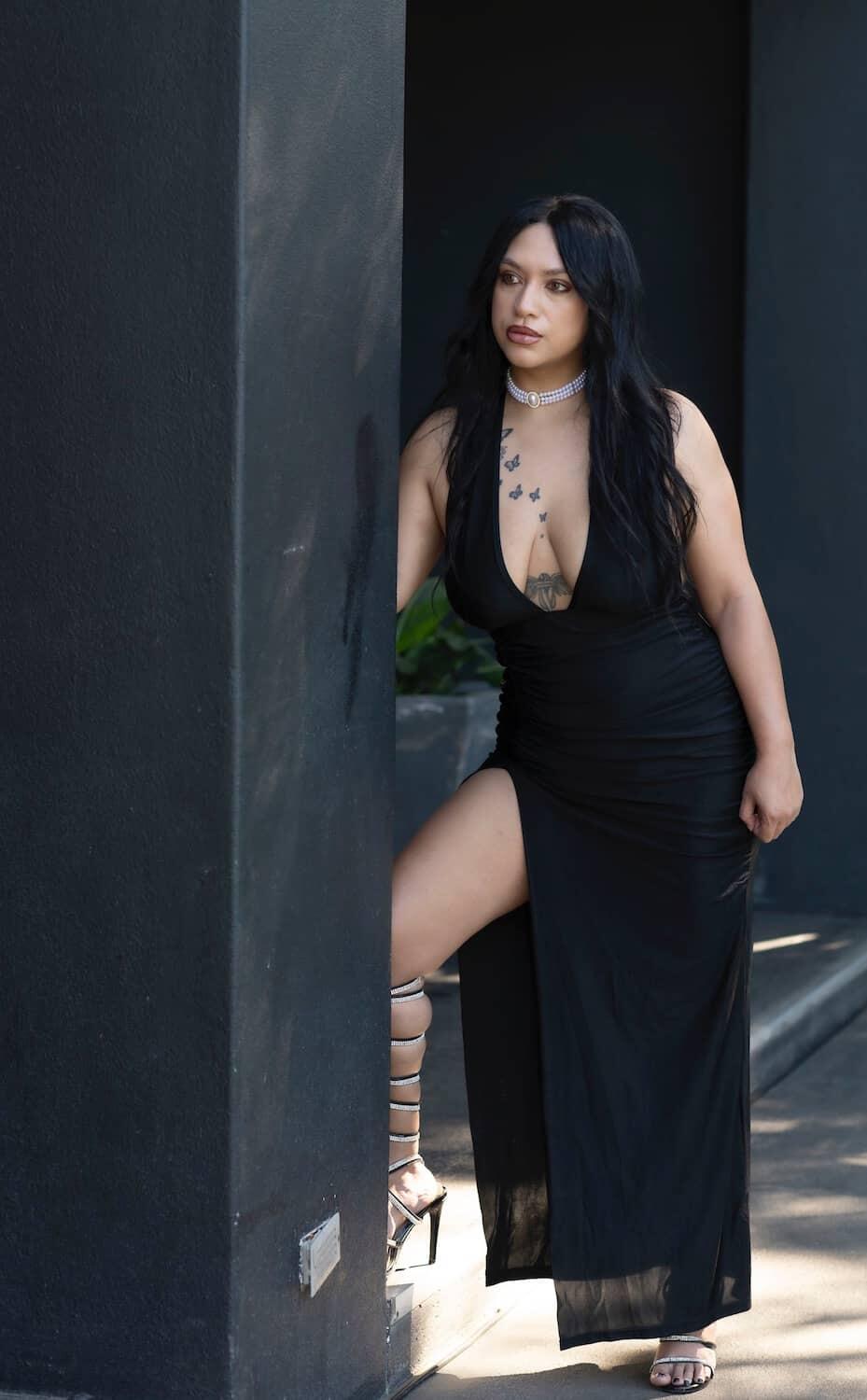 massage therapist amira in a black dress
